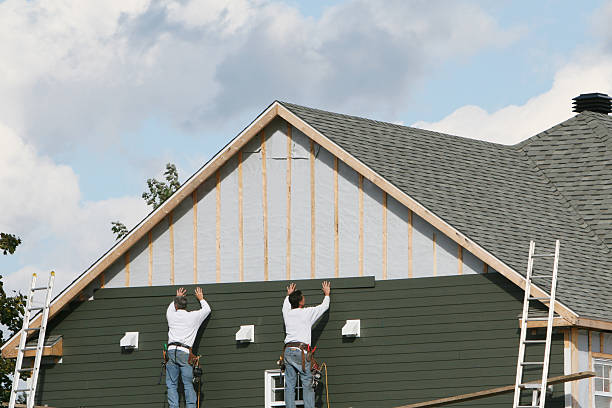 Professional Storm Damage Siding Repair technician working in Hollidaysburg, PA